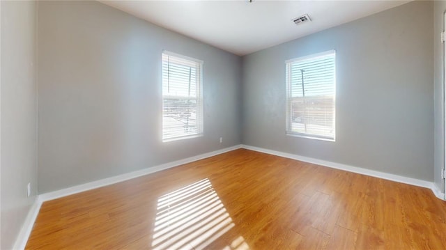 unfurnished room featuring light wood-type flooring