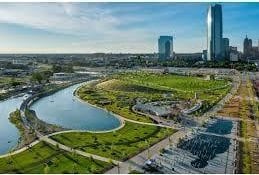 aerial view featuring a view of city and a water view