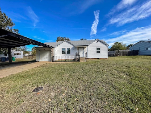 view of front of property featuring a front yard, a garage, and a carport