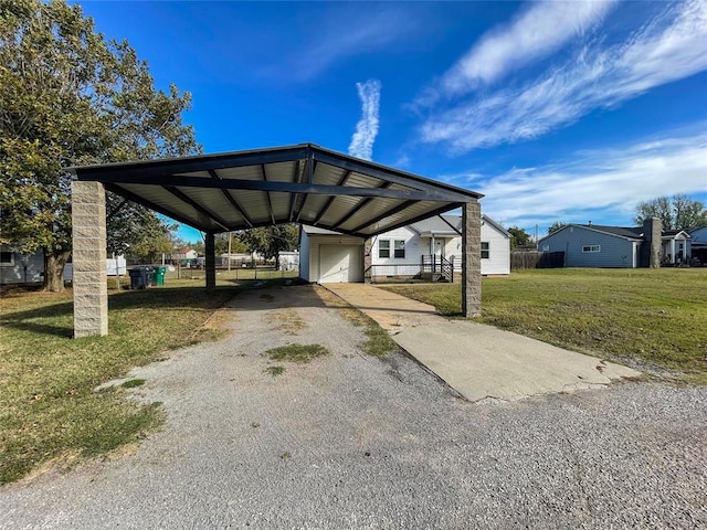 view of parking / parking lot featuring a yard, a carport, and a garage