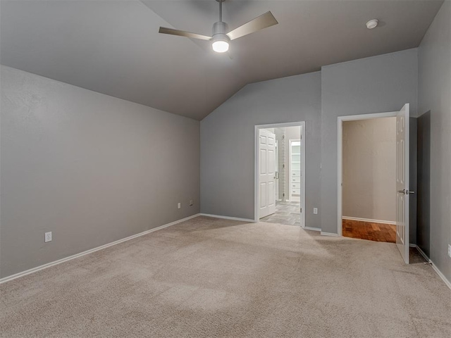 bonus room featuring baseboards, vaulted ceiling, a ceiling fan, and light colored carpet