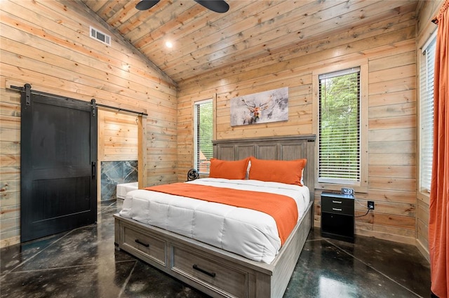 bedroom with a barn door, wood walls, ceiling fan, and wooden ceiling