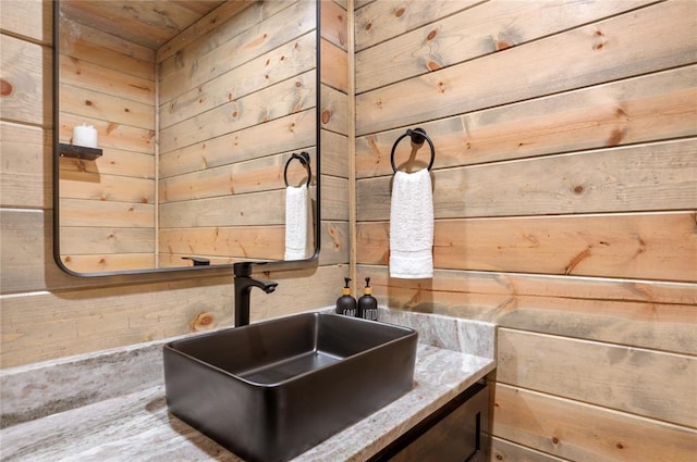 interior details with vanity and wooden walls