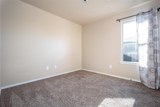 unfurnished room featuring carpet flooring