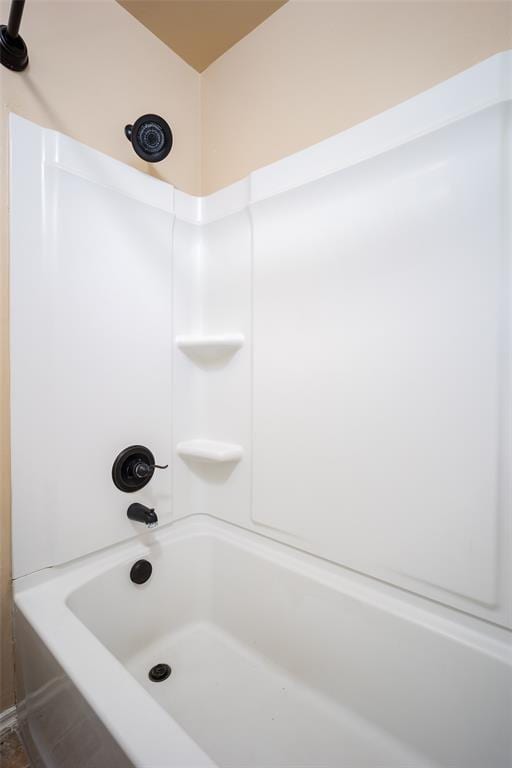 bathroom with shower / washtub combination