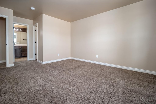 spare room featuring carpet