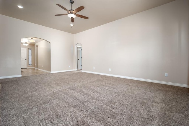 carpeted empty room with ceiling fan