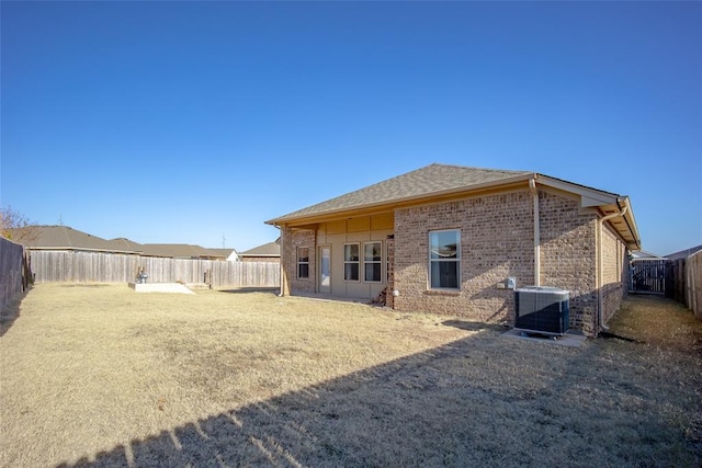 back of property featuring central AC unit