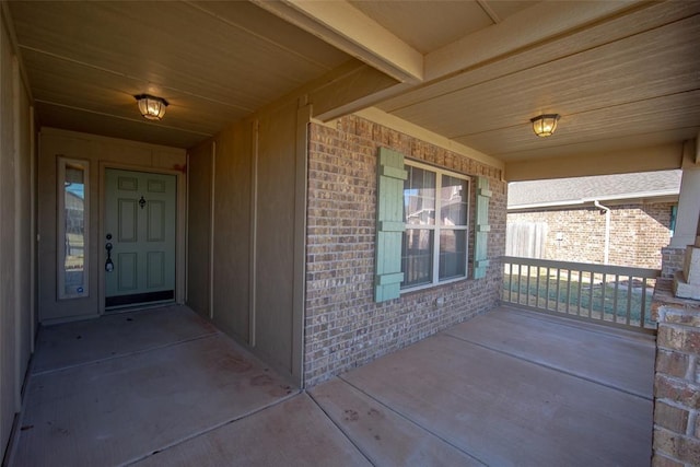 view of exterior entry featuring a porch