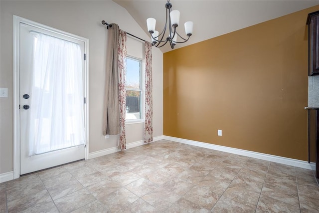 unfurnished dining area featuring an inviting chandelier and vaulted ceiling