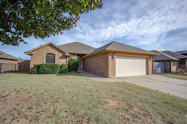 single story home with a front yard and a garage