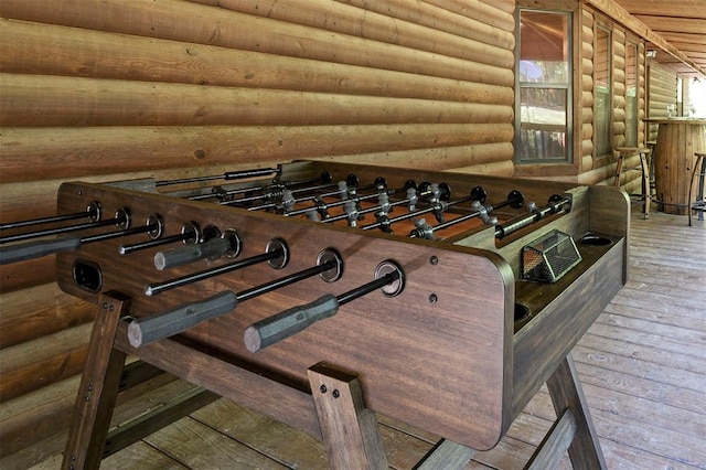 details featuring wood-type flooring and log walls