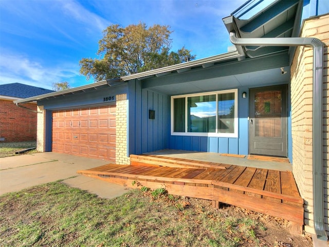 view of exterior entry featuring a garage