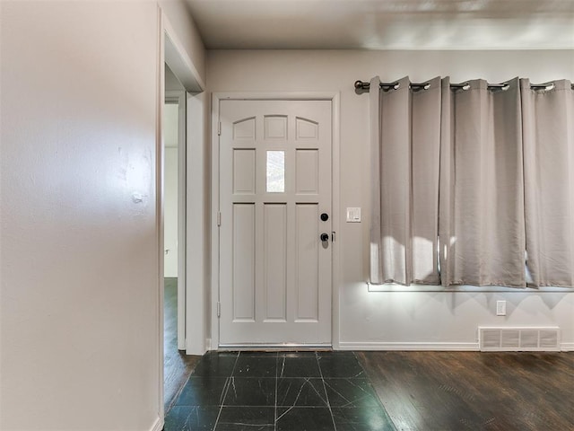 foyer entrance featuring dark hardwood / wood-style flooring