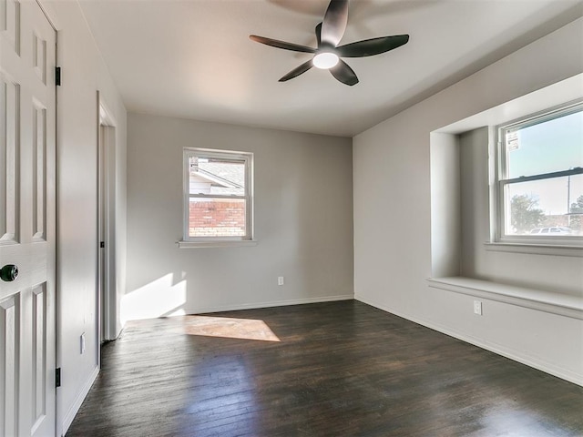 interior space with dark hardwood / wood-style flooring and ceiling fan