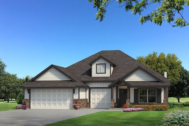 view of front facade featuring a front yard and a garage