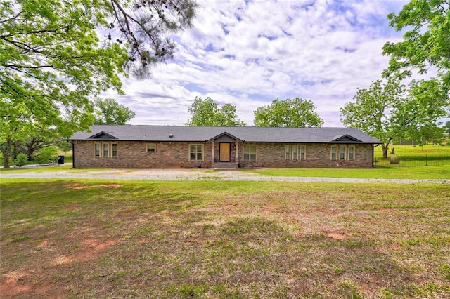 ranch-style house with a front lawn