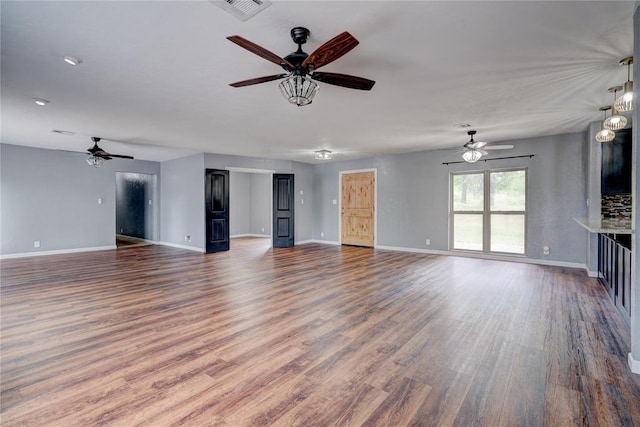 unfurnished living room featuring dark wood-type flooring