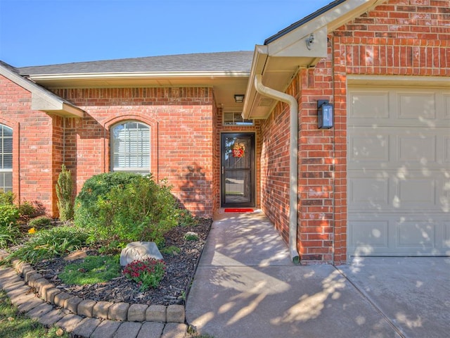 doorway to property featuring a garage