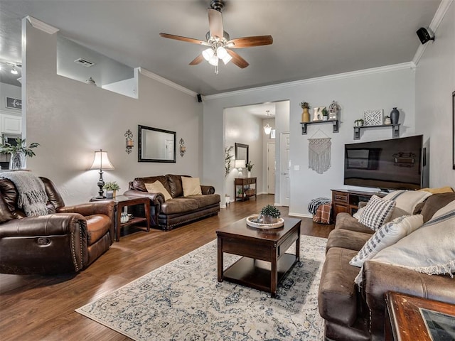 living room with crown molding, ceiling fan, and wood-type flooring