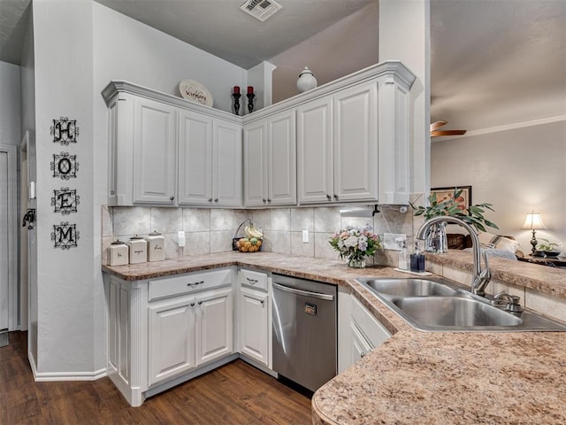 kitchen featuring white cabinetry, dishwasher, sink, dark hardwood / wood-style flooring, and backsplash