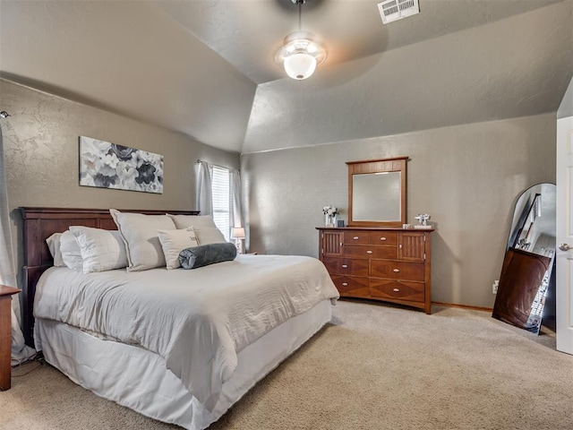 carpeted bedroom with ceiling fan and lofted ceiling