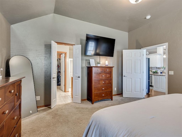 carpeted bedroom featuring lofted ceiling