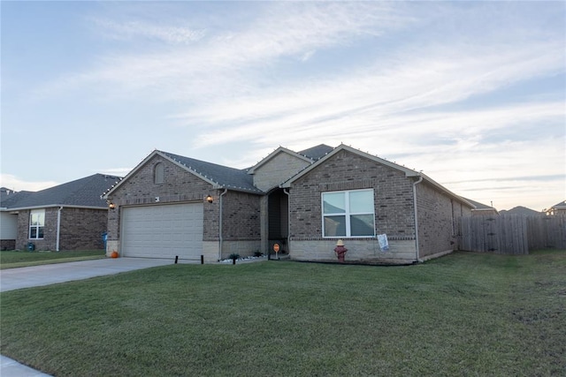 single story home with a front yard and a garage