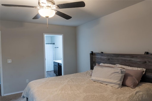 carpeted bedroom featuring ensuite bathroom and ceiling fan