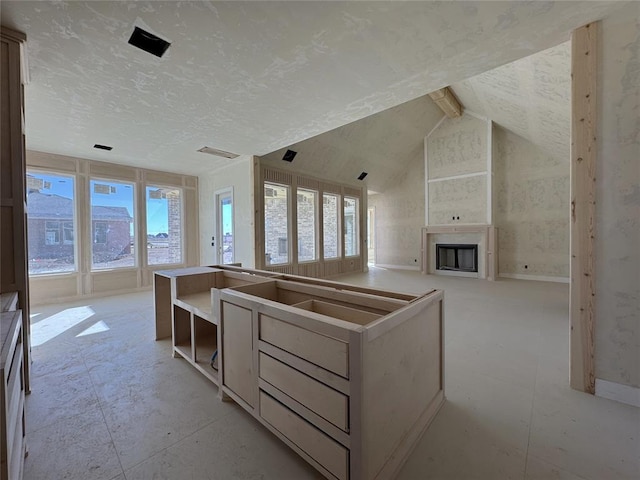 unfurnished living room with lofted ceiling with beams