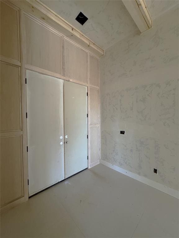 unfurnished bedroom with a closet