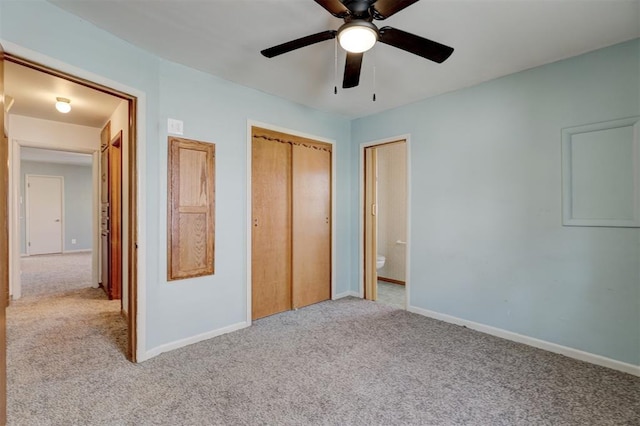 unfurnished bedroom with ceiling fan, a closet, and light colored carpet