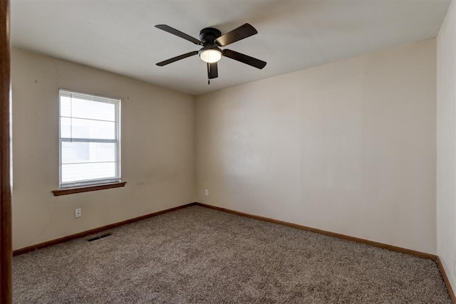 unfurnished room with ceiling fan and carpet floors