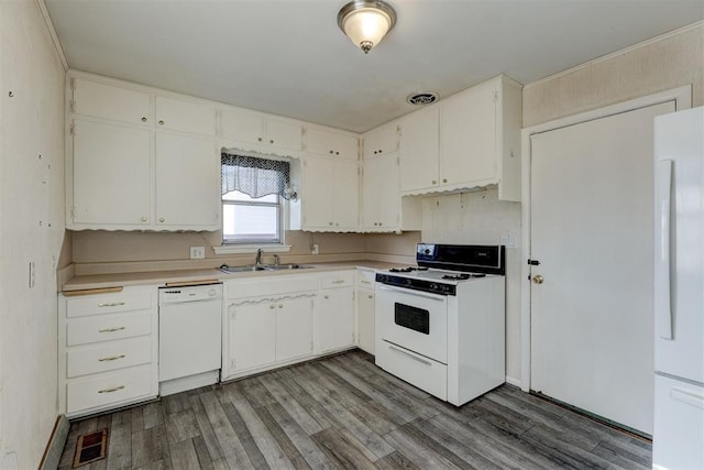 kitchen with white cabinets, wood-type flooring, white appliances, and sink