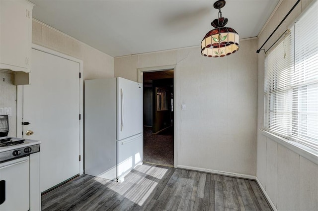 unfurnished dining area featuring dark hardwood / wood-style flooring