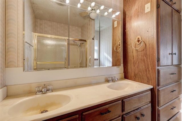 bathroom with vanity and an enclosed shower