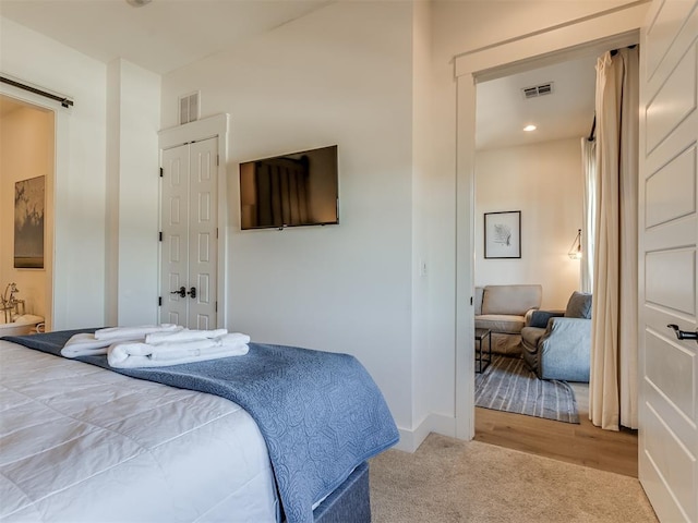 bedroom featuring light wood-type flooring