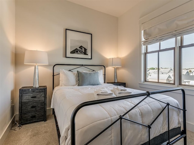 bedroom with light colored carpet