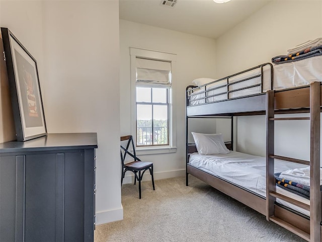 bedroom with light colored carpet