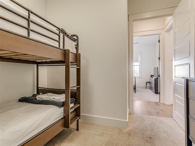 bedroom with light colored carpet