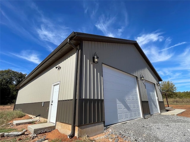 exterior space with a garage and an outdoor structure