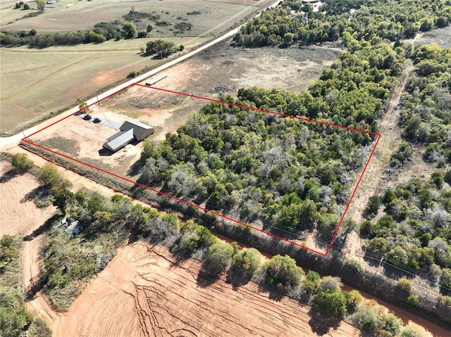 birds eye view of property with a rural view