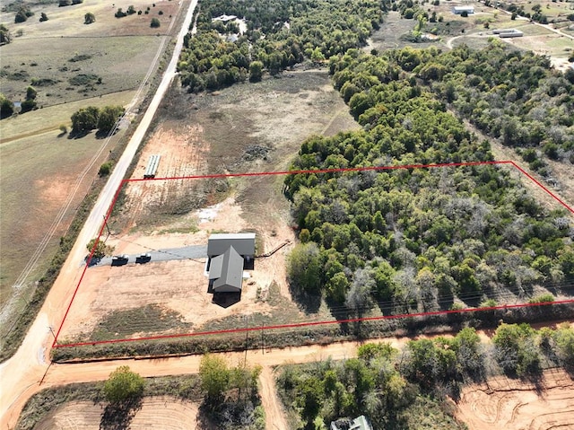 birds eye view of property with a rural view