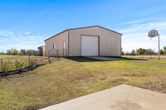 view of outbuilding with a yard and a garage