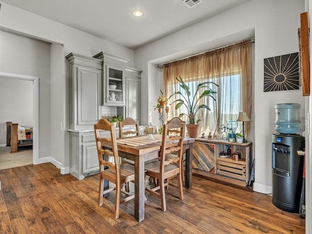 dining space with dark hardwood / wood-style floors