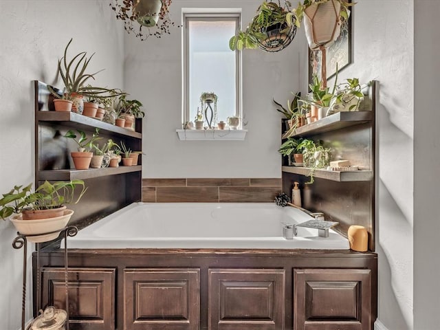 bathroom featuring a washtub