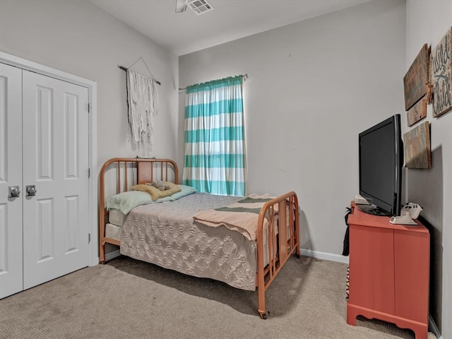 bedroom featuring a closet and carpet floors