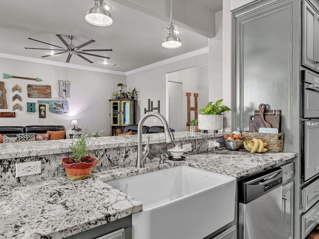 kitchen with stainless steel dishwasher, a sink, light stone counters, and crown molding