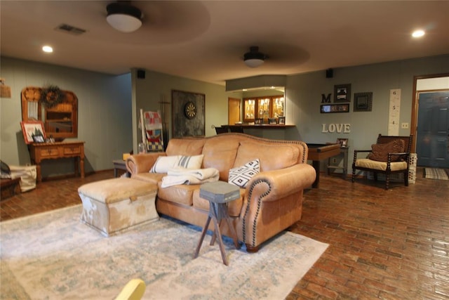 living room featuring ceiling fan and billiards