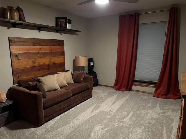 carpeted living room featuring ceiling fan